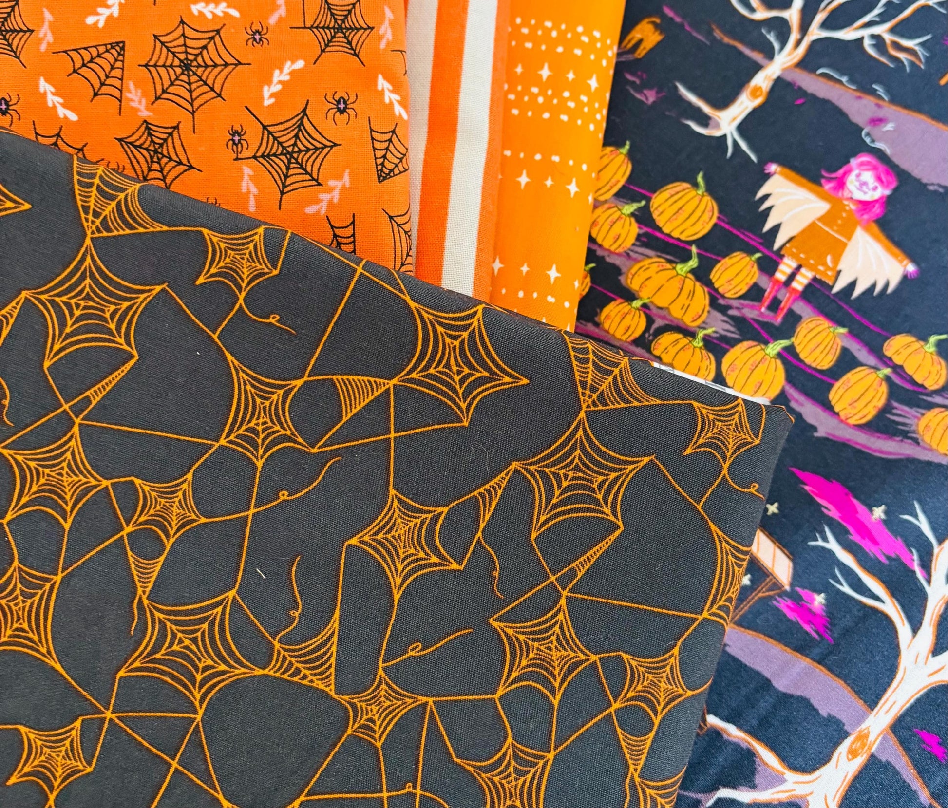 Eerie Essence - 14 fat quarter bundle - halloween blenders - orange - light mauve pink